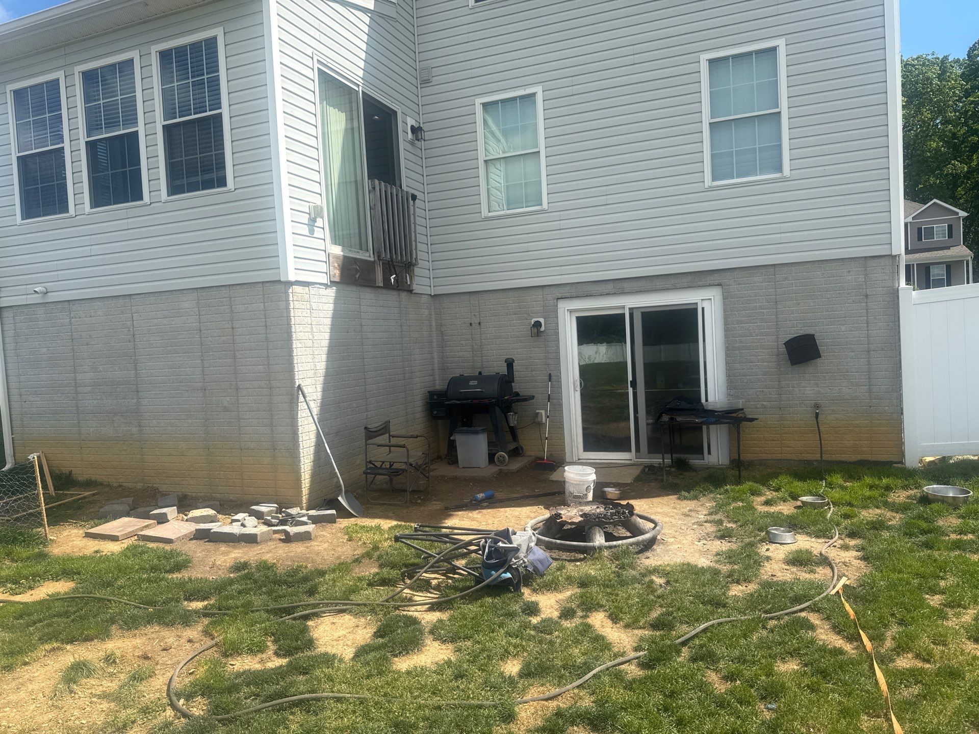 Back of a Hanover, PA home with the new deck outline marked below the second-floor sliding door